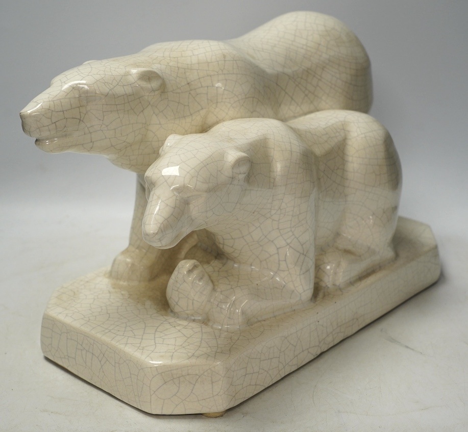 An Art Deco polar bear figure group, 34cm long. Condition - heavily crazed but good